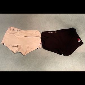 Two pairs of Reebok CrossFit shorts, both are in size XS, color black and white